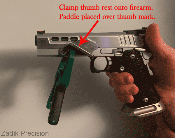 Clamping thumb rest to firearm.